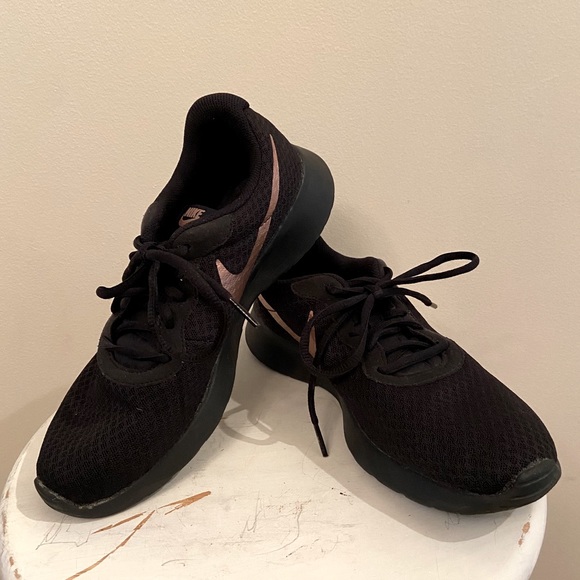 black and rose gold nike sneakers